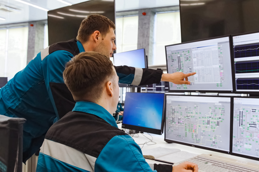 Operators Monitoring Chemical Plant Parameters